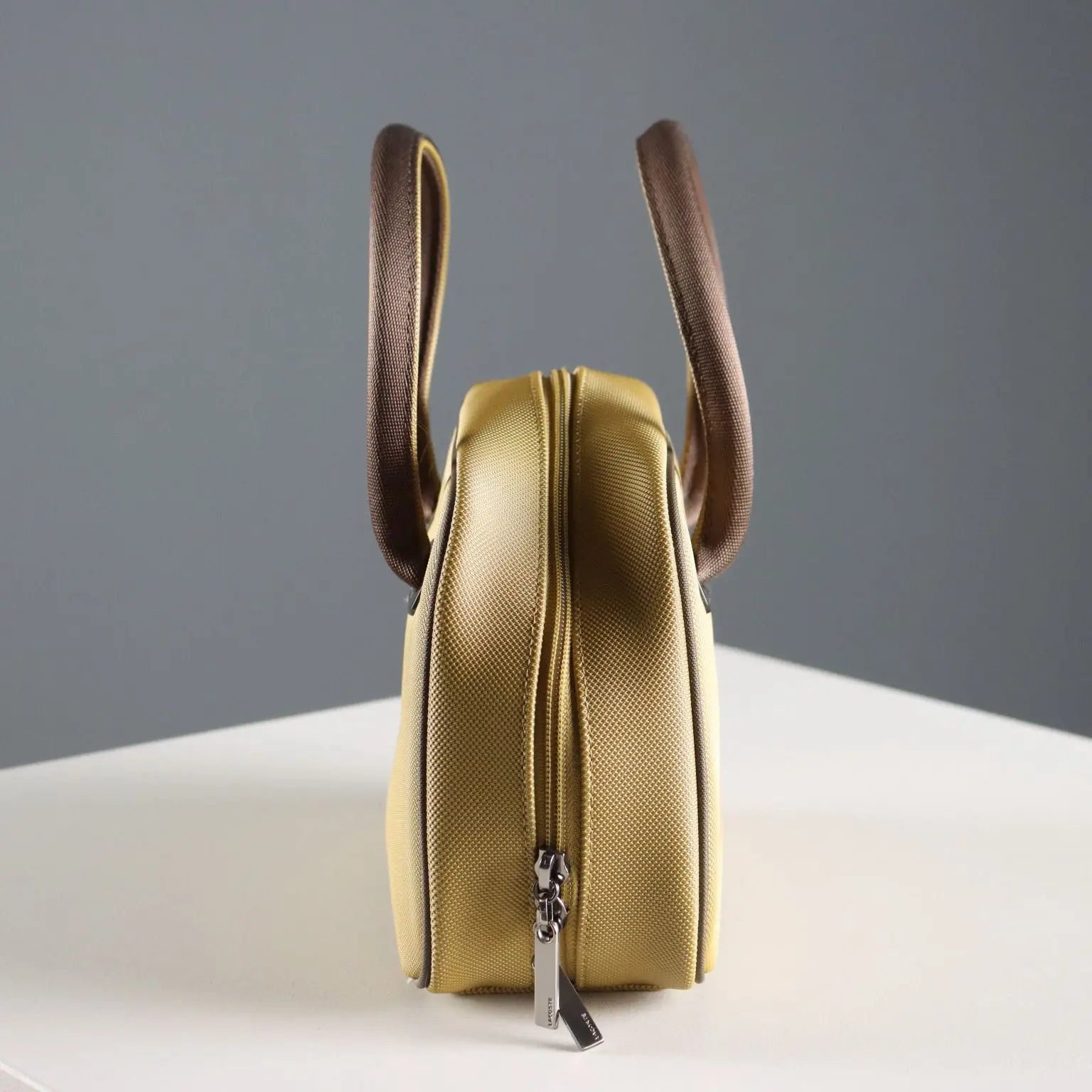 Lacoste Mini Bag L61 PVC Mustard France Second Hand | Clothing & House Linens | Second hand
