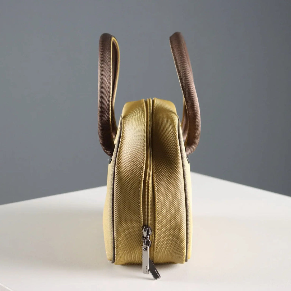 Lacoste Mini Bag L61 PVC Mustard France Second Hand | Clothing & House Linens | Second hand
