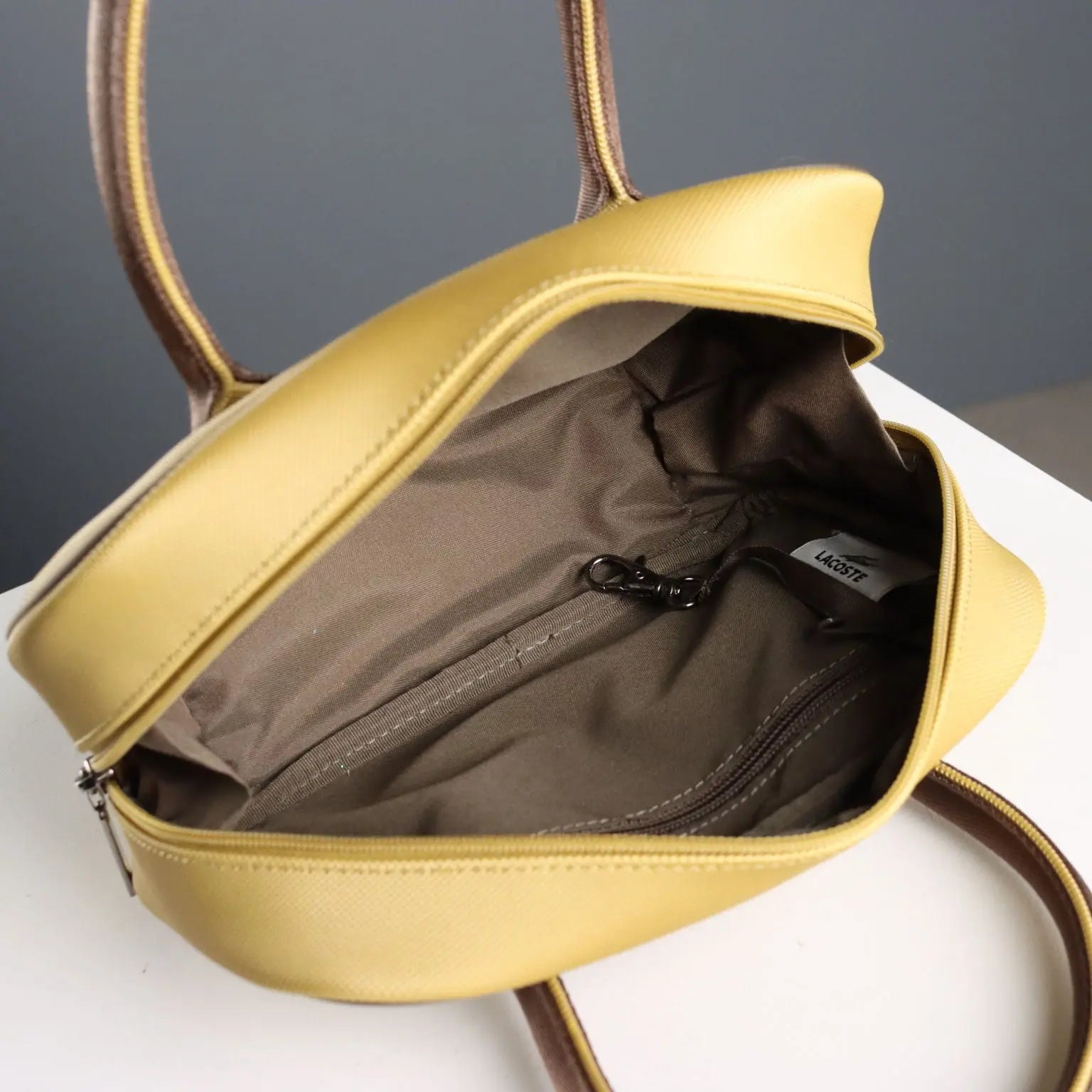 Lacoste Mini Bag L61 PVC Mustard France Second Hand | Clothing & House Linens | Second hand